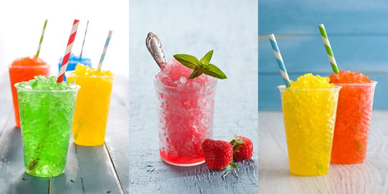 Kolorowe granity i napoje typu slushy w przezroczystych kubkach, z kruszonym lodem i pasiastymi słomkami; pośrodku różowy deser z miętą, truskawkami i łyżeczką. Więcej o różnicach między granitą a slushy znajdziesz na stronie AleLody.pl